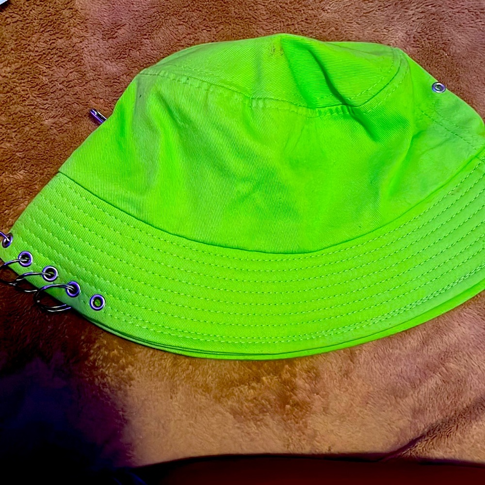 This is a neon green hat with pins